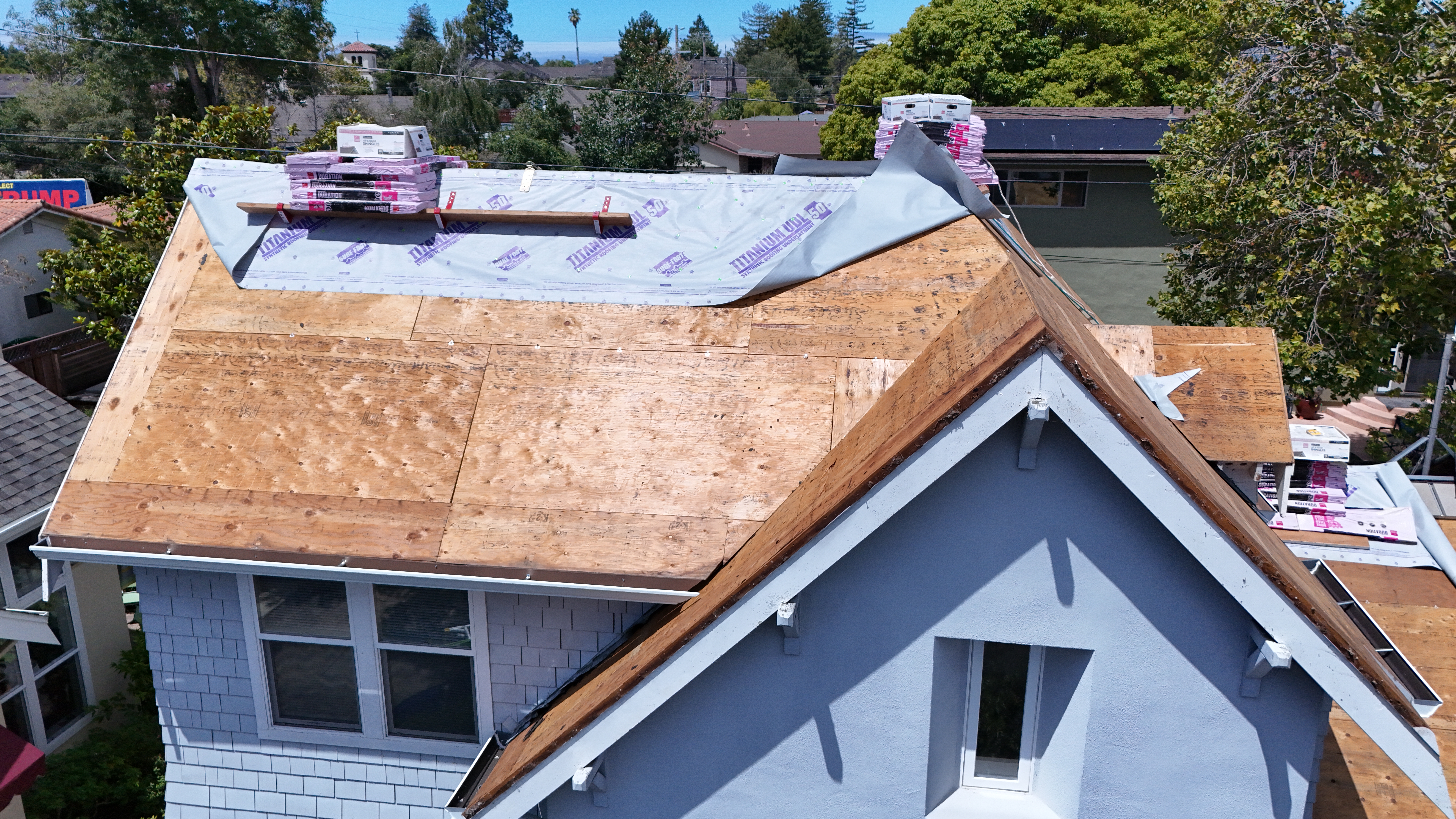 Close aerial view of new OSB sheathing and underlayment at front gable